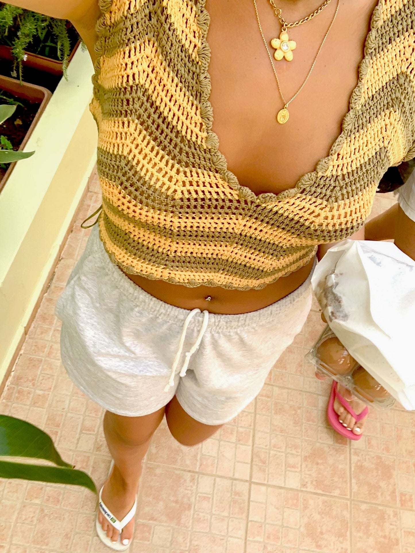 Nattalie är 167 cm lång och bär storlek M. | grå